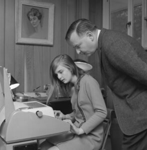 Math professor and future Dartmouth president John Kemeny looks over a program written by his daughter Jennifer Kemeny '76 using the Teletype computer terminal at their home. (Photo by Adrian N. Bouchard/courtesy of Rauner Special Collections Library)